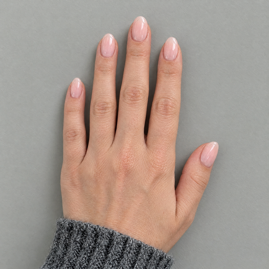 Barely There (Oval) press-on nails in an overhead flat lay matching the original model and sleeve
