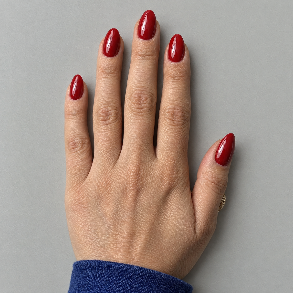 After Dark (Oval) press-on nails shown in an overhead flat lay with the matching model and sleeve