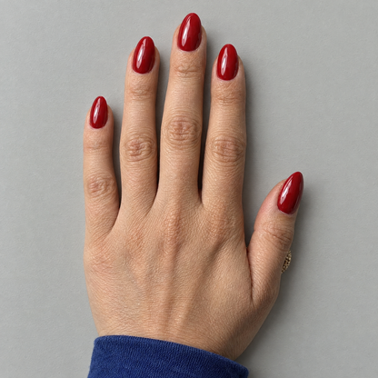 After Dark (Oval) press-on nails shown in an overhead flat lay with the matching model and sleeve